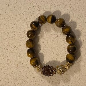 Tiger eye beaded stretch bracelet with gold accents and garnet looking stones